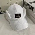 Close-up of white plush baseball cap with fuzzy earflaps and fashion embroidery - M (56-58cm) / White