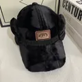 Detail of black plush baseball hat featuring a leather patch with fashion embroidery - M (56-58cm) / Black
