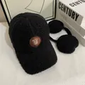 Detail of black faux shearling winter baseball cap with plush texture and leather logo patch - M (56-58cm) / Black