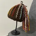 Detailed view of handmade brown knit hat featuring colorful yarn dreadlocks and long tassels - M (56-58cm) / Coffee