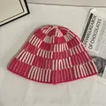 Detailed knit texture of pink and white striped crochet winter bucket hat in cozy style - M(56-58cm) / Rose Red