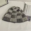 Detail of grey and white checkerboard knit pattern on a warm winter bucket hat - M(56-58cm) / Gray