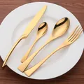 Modern 4-piece stainless steel cutlery set with elegant gold mirror finish for dining - Gold