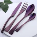 Polished purple stainless steel flatware set with fork knife and spoons on white plate - Purple
