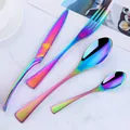 4-piece rainbow iridescent stainless steel cutlery set on marble surface - AB Color