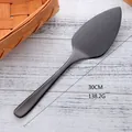 Matte black stainless steel pizza server with serrated edge for easy cutting, 30cm length - Black
