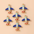 Airplane and globe charms for DIY jewelry making with colorful enamel and gold finish - Airplane