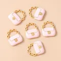 Detail view of pink mini handbag charms with gold chain handles for DIY jewelry making - Pink