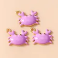 Detail view of purple enamel crab pendants with gold finish for DIY jewelry making - Purple