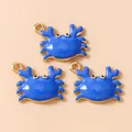Detailed view of blue enamel crab pendants with gold-plated alloy for DIY jewelry - Blue