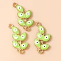 Detail of green leaf connectors with evil eye charms in gold finish for DIY jewelry - Gold Green