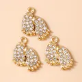 Three gold paw print pendants with white rhinestones for DIY jewelry making - Gold