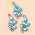 Macro shot of three sky blue evil eye leaf charms with double rings for jewelry making - Silver Blue