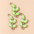 Detailed view of green enamel leaf charms with evil eye design for jewelry DIY - Silver Green