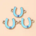 Macro detail of blue horseshoe evil eye pendants with double connectors and enamel finish - Silver Blue
