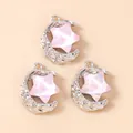 Close-up of alloy moon and star pendants with lava texture and pink cat-eye stars - 5 Pieces/Pack / Silver Pink