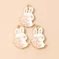 Three cute white cartoon rabbit charms with carrots for DIY jewelry and necklaces - Pink