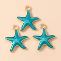 Three gold-plated starfish charms with teal enamel filling and top rings for DIY jewelry - Blue