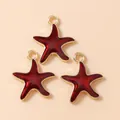 Three starfish pendants with gold frame and deep red enamel for DIY jewelry making - Red