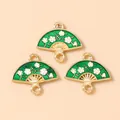 Detail of green floral fan charms with gold edges and white plum blossom patterns - Fan Dangle / Green