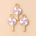 Vue détaillée de trois breloques sucettes en émail violet et blanc pour la création de bijoux - Violet