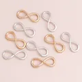 Detailed view of infinity symbol alloy charms in gold and silver for DIY jewelry making - Multicolor