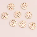 Set of 8 golden hollow geometric round charms for jewelry making on pink background - Gold