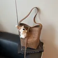 Brown hollow-out bucket bag in lychee texture leather with a cute white puppy pendant - 29*13*28 / Brown Hollow Bucket Bag With Plush Pendant / Brown with Pendant