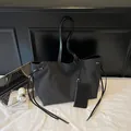 Large black canvas tote bag with leather straps and matching small zipper pouch - Black