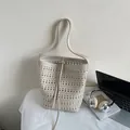Cream white bucket bag featuring laser-cut geometric patterns and shoulder strap - Rice White (No Pendant)