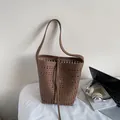 Dark brown hollow-out leather bucket bag with laser-cut geometric patterns and drawstrings - Brown No Pendant