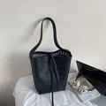 Minimalist black laser-cut hollow bucket bag with shoulder strap and drawstring closure - Black without Pendant