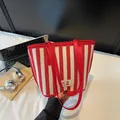 Chic red and white striped canvas tote bag with leather handles and branded square label - Burgundy