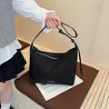 Minimalist black nylon bucket bag with adjustable shoulder strap and metal logo - 34*11*23cm / Black