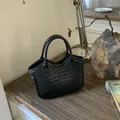 Mini black woven bucket bag with leather cross-weave and dual cylindrical handles - Black without Pendant