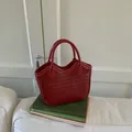 Dark red woven bucket bag with intricate leather weave and curved top handle - Red (No Pendant)