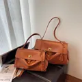 Brown vintage faux leather tote bag with gold lock buckle and pleated detail in two sizes - Large / Brown
