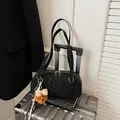 Black leopard print bowling bag with a teddy bear charm and metal dual zippers - With Pendant / Black