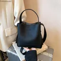 Chic black litchi grain leather bucket bag featuring a versatile single handle and strap - 19*19*12 / Black