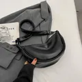 Minimalist black crescent crossbody bag in premium PU leather with adjustable strap - Small / Black