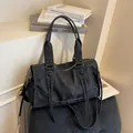 Retro matte black large capacity shoulder bag with metal belt and lace-up details - Black