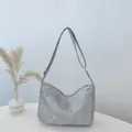 Metallic silver crossbody tote bag with a distressed texture and adjustable wide strap - Silver