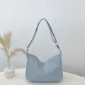 Light blue-grey crescent tote bag in matte leather with adjustable shoulder strap - Blue