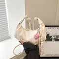 Chic pleated croissant handbag in creamy white with stylish knotted handle and heart charm - With Pendant / White