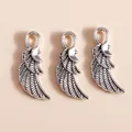 Detailed close-up of antique silver alloy wing charms for DIY jewelry crafting and accessories - Antique Silver