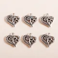 Detail of vintage heart-shaped hollow charms in antique silver finish for DIY jewelry - Antique Silver