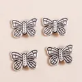 Detail of vintage silver butterfly charms with embossed wing textures for jewelry making - Antique Silver