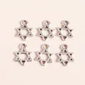 Macro detail of six pointed star alloy charms with antique silver finish for DIY jewelry - Silver