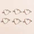 Macro shot of silver plated heart and arrow charms for DIY jewelry making sets - Antique Silver