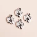 Macro shot of retro silver metal baby footprint charms with detailed toe contours for DIY - Antique Silver